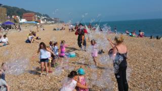 Bubble performer on beach