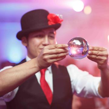 Man looking into glass ball