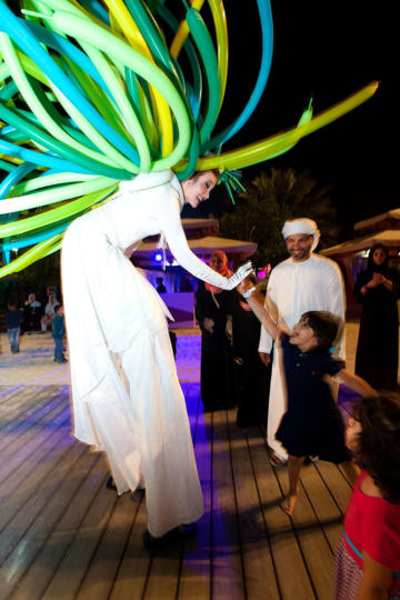 Stilt walker in balloon costume
