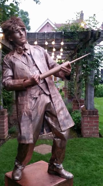 Bronze mad scientist living statue