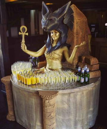 Woman dressed as Egyptian living table