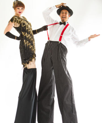 Gatsby formal stilt walkers