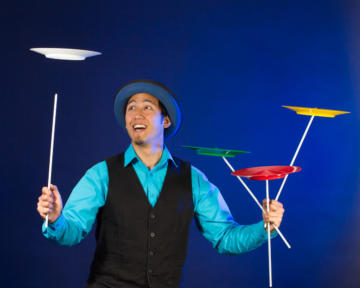 Circus performer Spinning plates