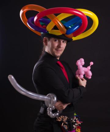 man balloon modelling with balloon sword and hat