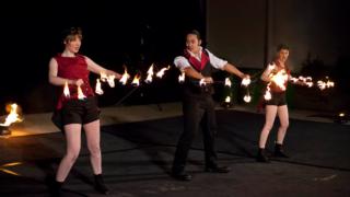 stage show performers do fire dance